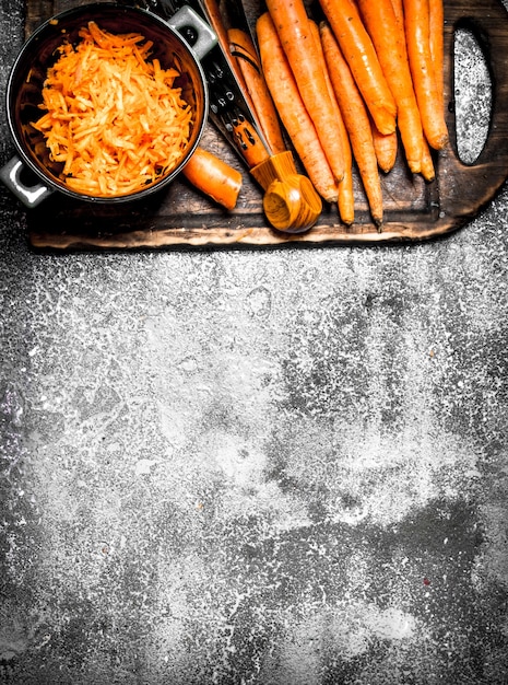 Organic fresh carrots. On the rustic table.