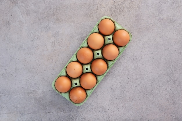 Organic fresh eggs on table Flat lay