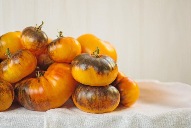 Organic fresh juicy brown and yellow tomatoes