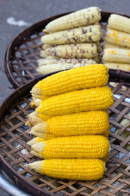 Organic fresh sweet corn for sale at a local farmers market in Thailand close up