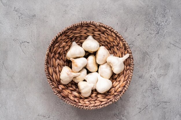 Organic garlic cloves in small basket.