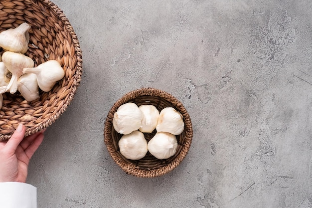 Organic garlic cloves in small basket.