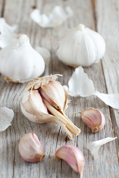 Organic garlic on the old wooden table close up