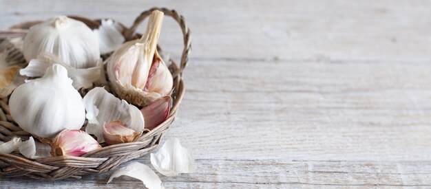 Organic garlic on the old wooden table close up