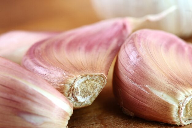 Organic garlic on wooden cutting board