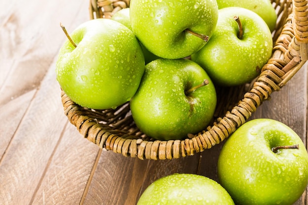 Organic Granny Smith apples on the table.