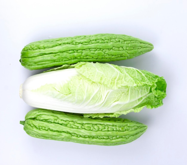 Organic green gourd and lectuce vegetables isolated on white background