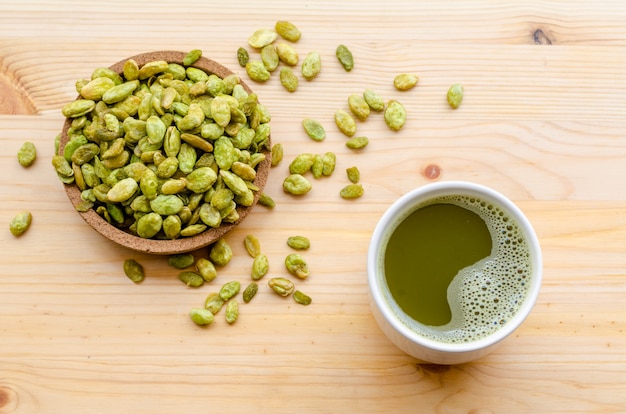 Organic Green Matcha Tea and edible seeds of hyacinth bean snack