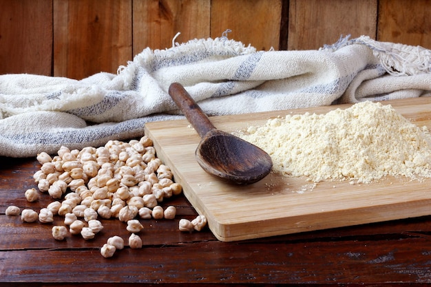 Organic homemade chickpea flour over rustic wooden table gluten free