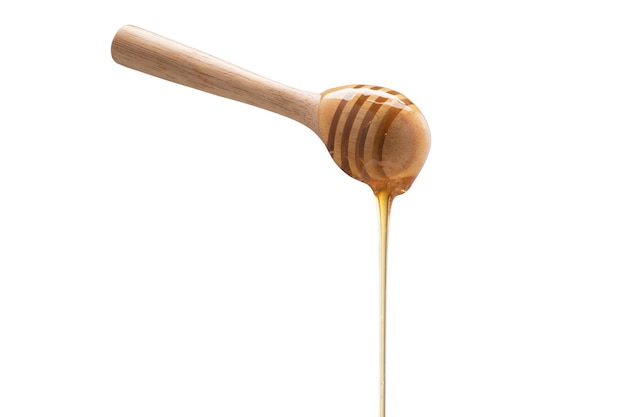 Organic Honey with wooden spoon on white