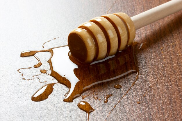 Organic honey and wooden dipper