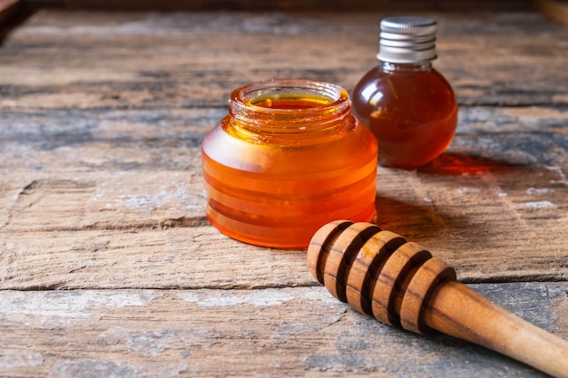 Organic honey on wooden table