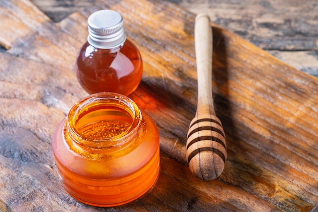 Organic honey on wooden table