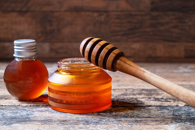 Organic honey on wooden table