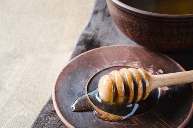 Organic honey on wooden table.