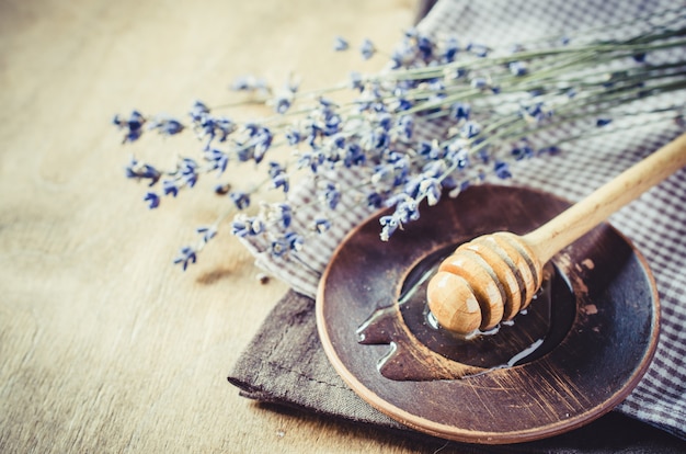 Organic honey on wooden table.