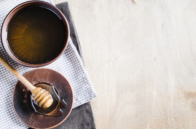 Organic honey on wooden table.