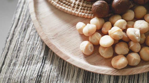 Organic Macadamia nut macadamia nuts are cracked and baked to taste extremely delicious superfood fresh natural shelled unsalted raw macadamia and healthy food concept