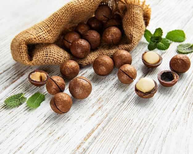 Organic Macadamia nuts on a wooden table