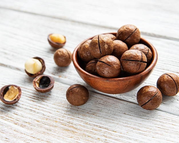 Organic Macadamia nuts on a wooden table