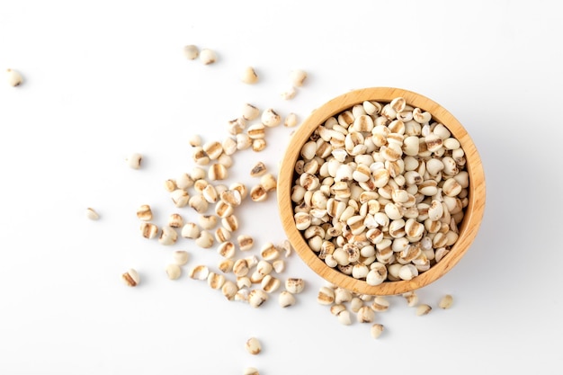 organic millet grains on white background