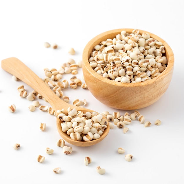 organic millet grains on white background