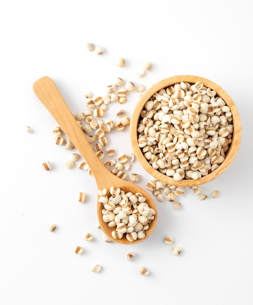 organic millet grains on white background