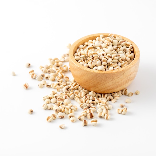 organic millet grains on white background