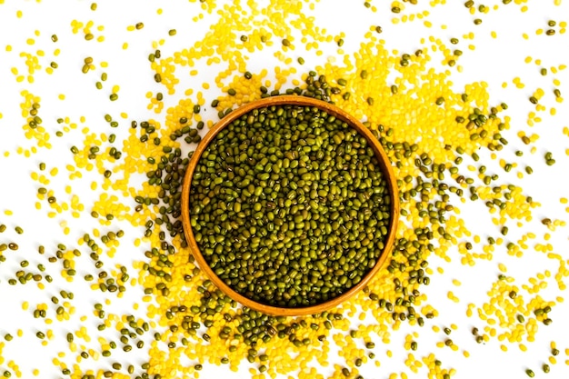 Organic mung beans in wooden bowl on white background