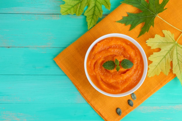 Organic pumpkin puree in a white bowl