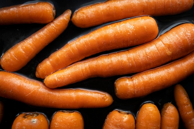 Organic raw carrots in water