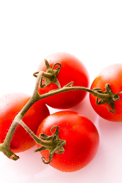 Organic Roma tomatoes on white background.