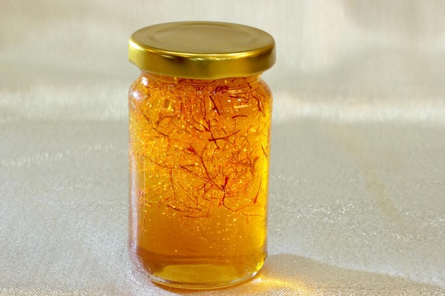 Organic saffron honey in a jar