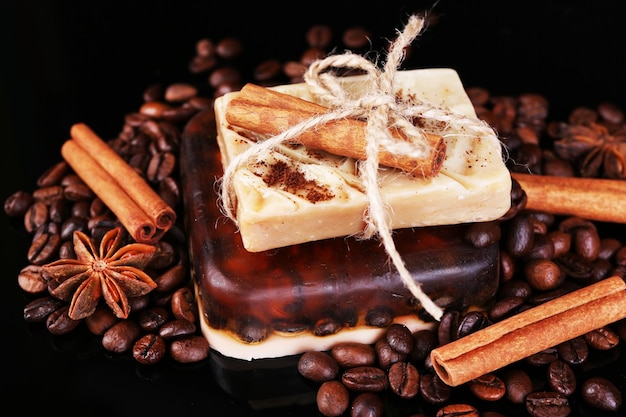 Photo organic soap with coffee beans and spices on dark background