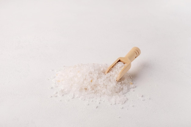 Organic spa sea salt and wooden scoop