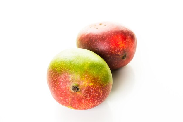 Organic tropical fruits on a white background.