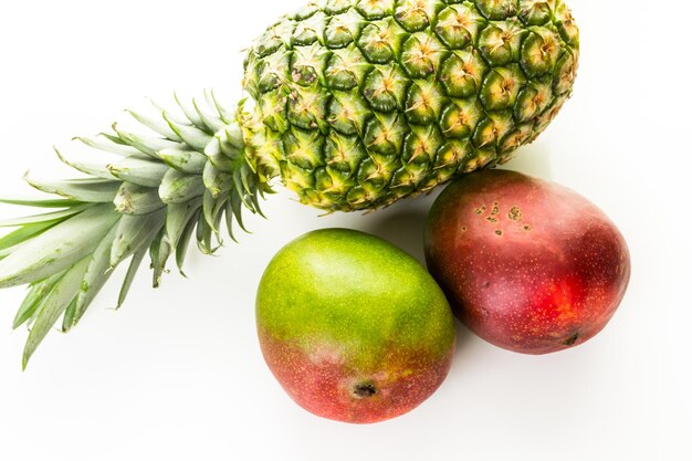 Organic tropical fruits on a white background.