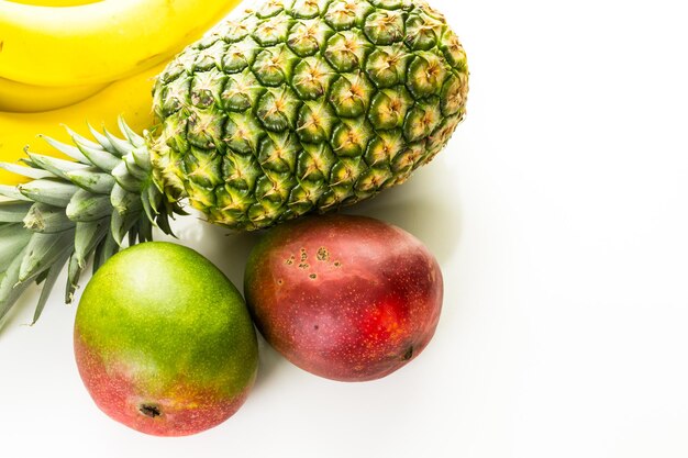 Organic tropical fruits on a white background.