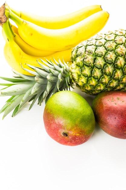 Organic tropical fruits on a white background.