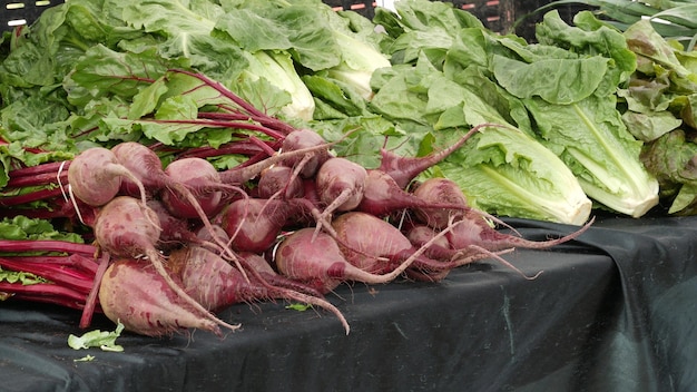 Organic vegetables on counter fresh local produce homegrown on stall farmers food market in usa