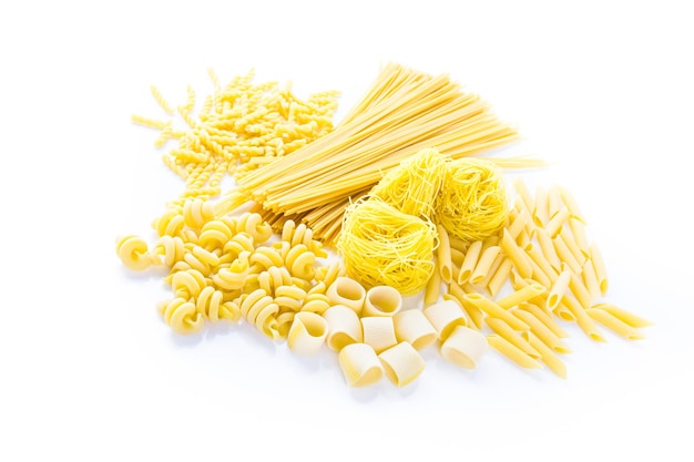 Organic yellow pasta on a white background.