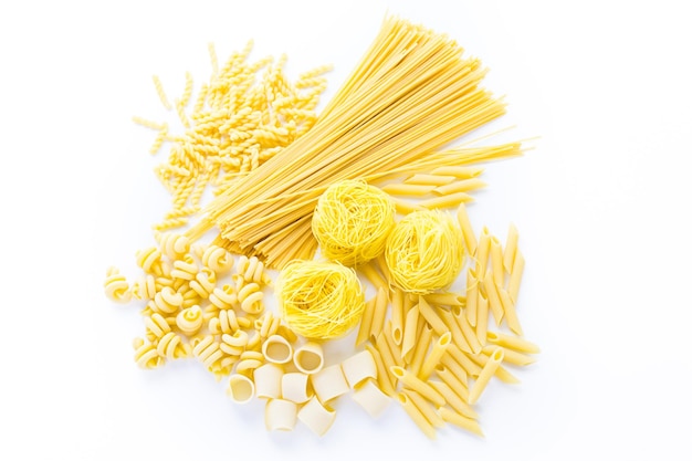 Organic yellow pasta on a white background.