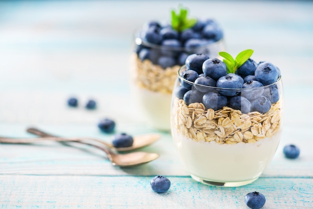 Organic yogurt with blueberries and muesli close up