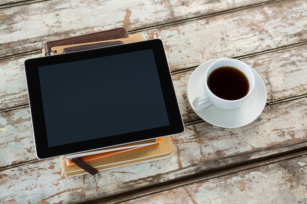 Organiser with digital tablet and coffee