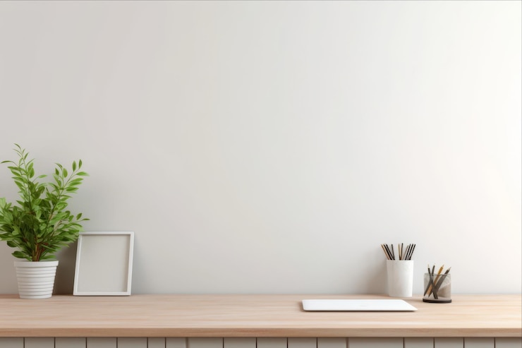 Organize Your Workspace A Home Desk With Office Supplies and a White Blank Wall for Productivity