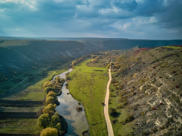 Orheiul Vechi hills and river scenery in Moldova . Valley of river Raut in villages Butuceni and Trebujeni from Moldova . Famous touristic place . Church on the top on the hill