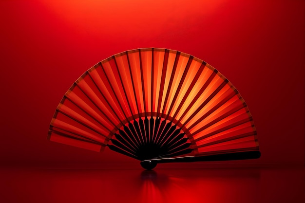 Oriental Fan Against a Red Background