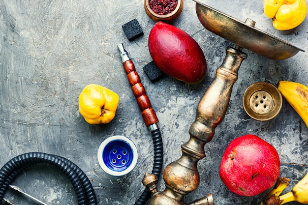 Oriental fruit smoking hookah.