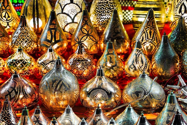 Oriental Metal crafts in Egypt. Selective focus. Gold, silver and copper lamp pieces in the Market. Background of oriental lampshades in a souk. High quality photo