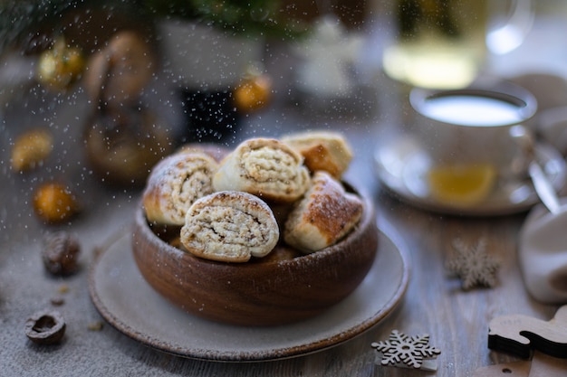 Oriental pastry made from puff pastry and wrapped in it a filling of sugar, butter and walnut. Armenian national pastry ghat or kyat with New Year's serving.. Selective focus